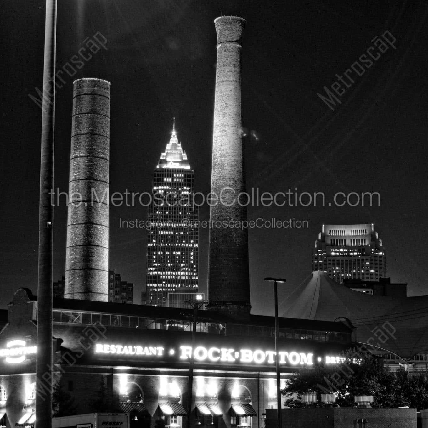 The Key Bank Building is Framed by Smoke Stacks from the Rock Bottom Brewery Wall Art square crop